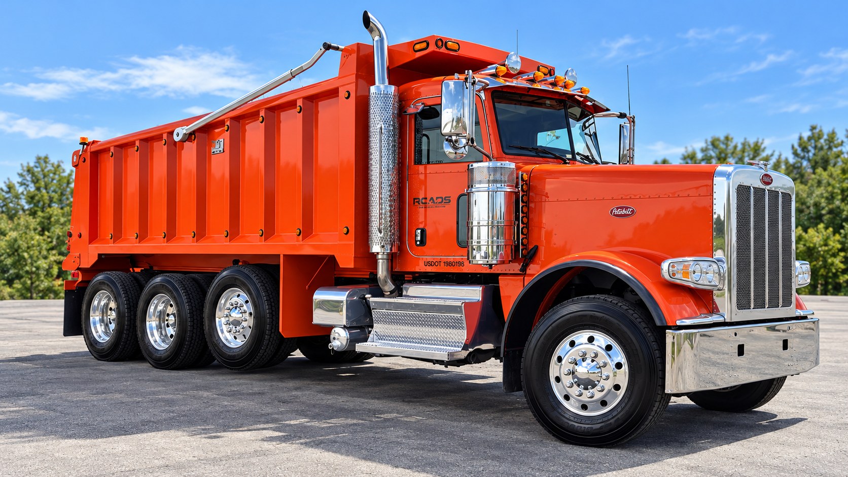 Michigan Roads orange Peterbilt dump truck, presented in a cleaned-up equipment photograph